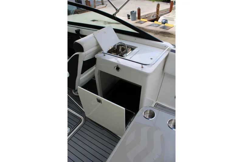 Slide: The Image of Interior of 2021 Monterey 255SS Super Sport boat with open storage and sink. - 34