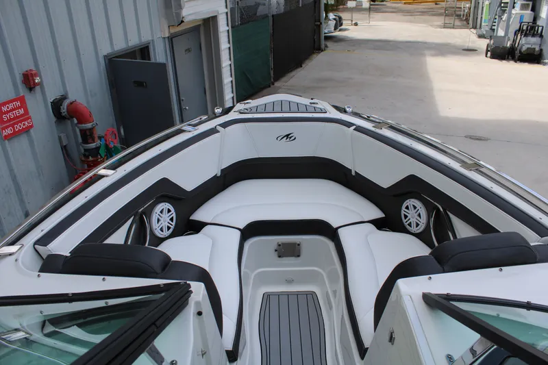 Slide: The Image of 2021 Monterey 255SS Super Sport boat interior with white seating and speakers. - 16