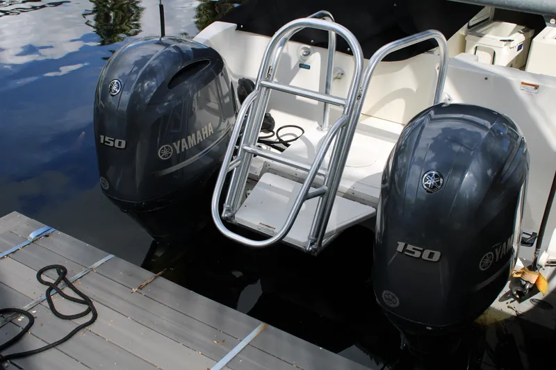 Slide: The Image of 2021 World Cat 255 DC boat with dual Yamaha 150 outboard engines at dock. - 33
