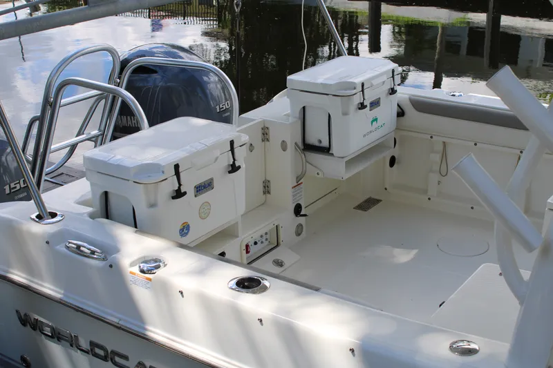 Slide: The Image of 2021 World Cat 255 DC boat interior with Yamaha engines and storage compartments. - 38