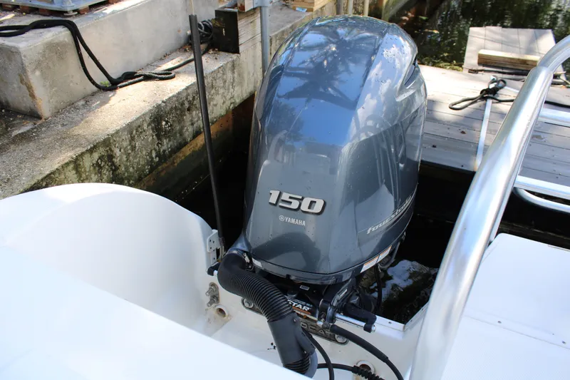 Slide: The Image of Yamaha 150 outboard motor on 2021 World Cat 255 DC boat at dock. - 34