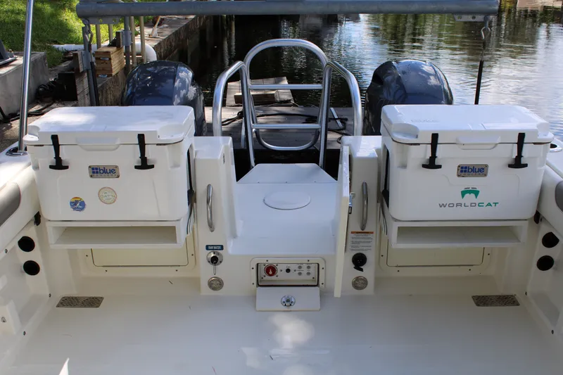 Slide: The Image of 2021 World Cat 255 DC boat deck with dual coolers and twin engines. - 40
