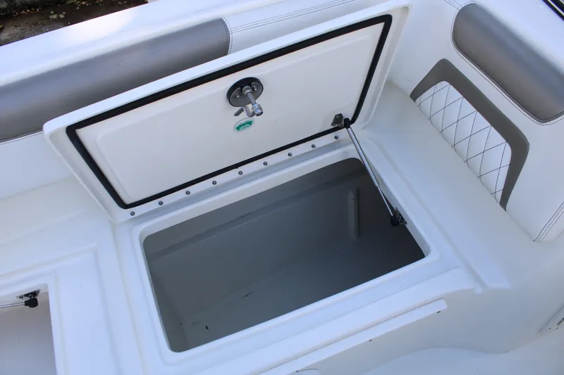 Slide: The Image of Open storage compartment on a 2021 World Cat 255 DC boat. - 16