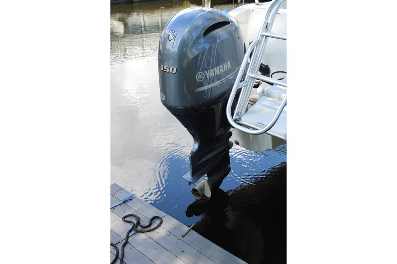 Slide: The Image of Yamaha 150 outboard motor on 2021 World Cat 255 DC boat at dock. - 39