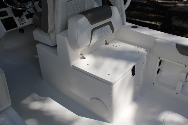 Slide: The Image of Interior seating of 2021 World Cat 255 DC boat with storage compartment. - 25