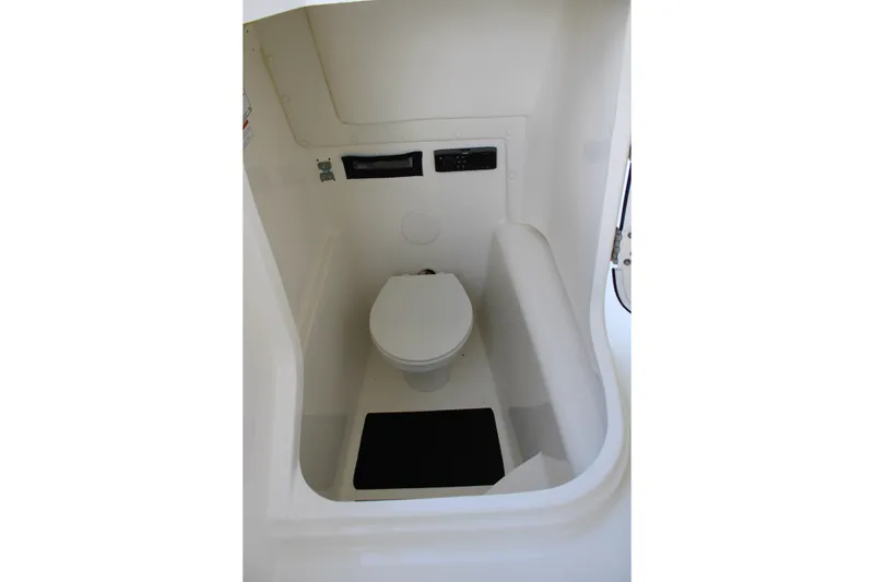 Slide: The Image of 2021 World Cat 255 DC boat interior with compact marine toilet. - 30