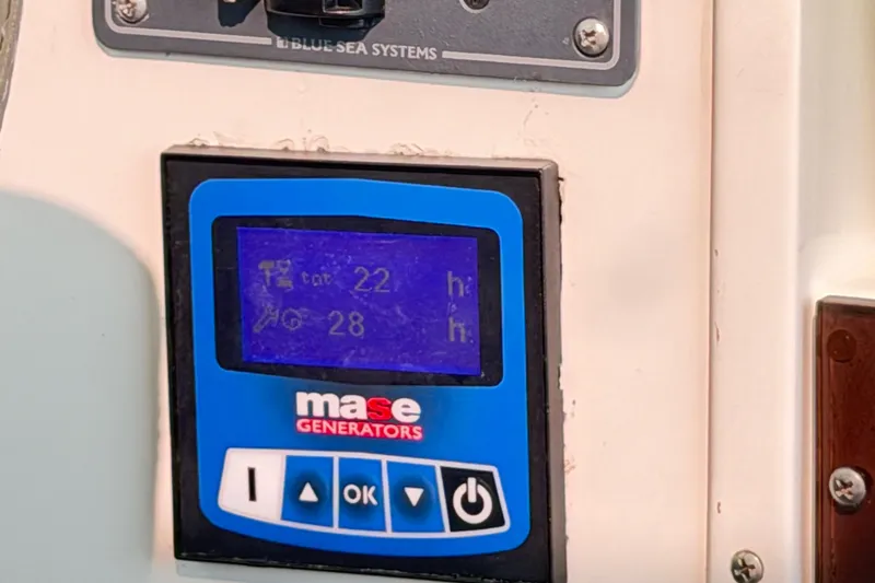 Slide: The Image of Control panel of a Mase generator on a 2024 Sardine Marine 34 boat. - 36