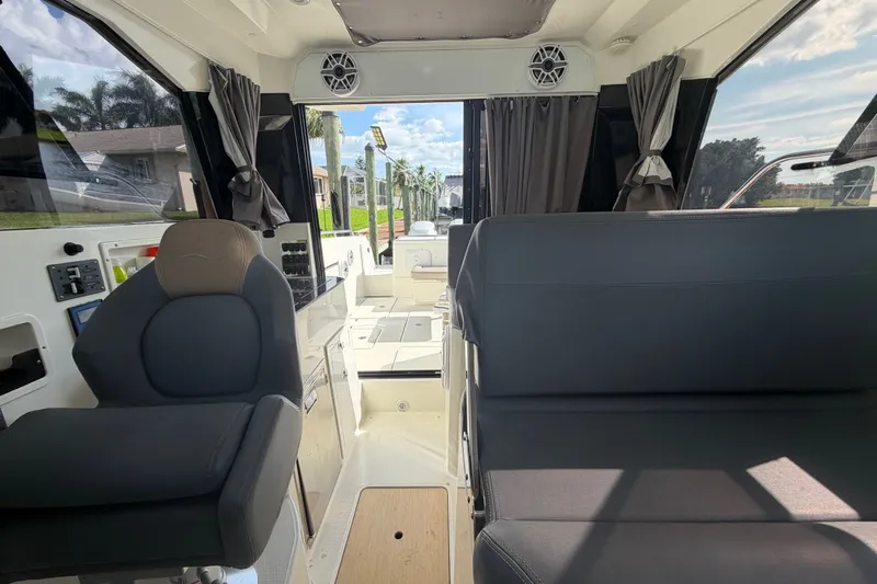 Slide: The Image of Interior of 2024 Sardine Marine 34 boat, featuring modern seating and sleek design. - 28