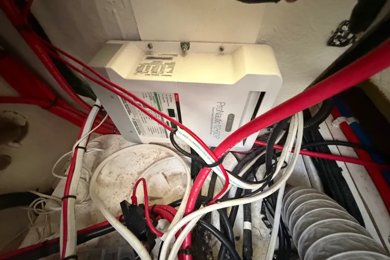 Slide: The Image of Electrical wiring and ProMariner ProNautic charger in Sardine Marine 34, 2024 model. - 20