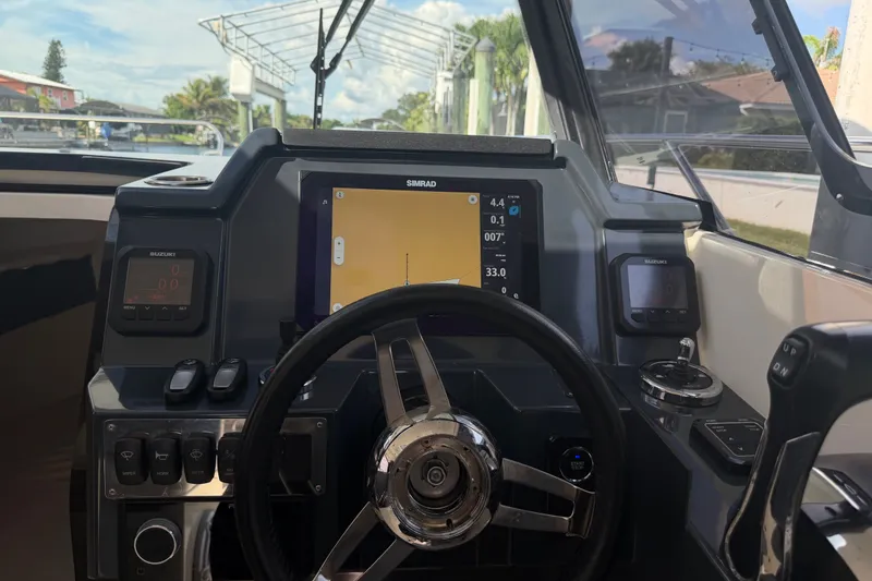 Slide: The Image of Cockpit of 2024 Sardine Marine 34 boat with navigation display and controls. - 30