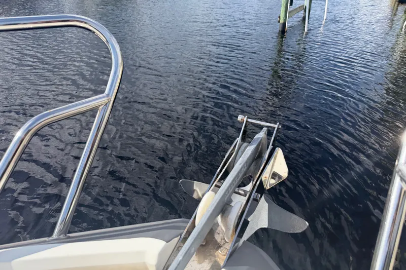 Slide: The Image of Bow of 2024 Sardine Marine 34 boat with anchor over calm water. - 38