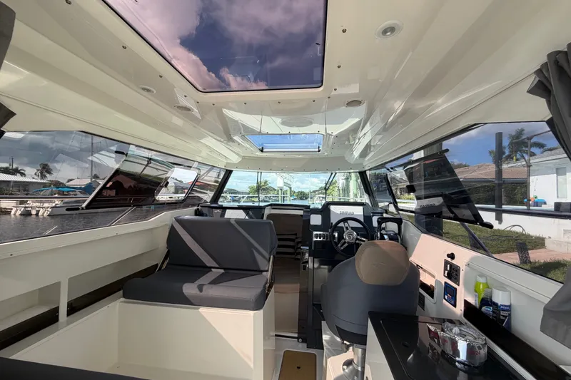 Slide: The Image of Interior of 2024 Sardine Marine 34 boat, featuring modern cockpit and seating area. - 31