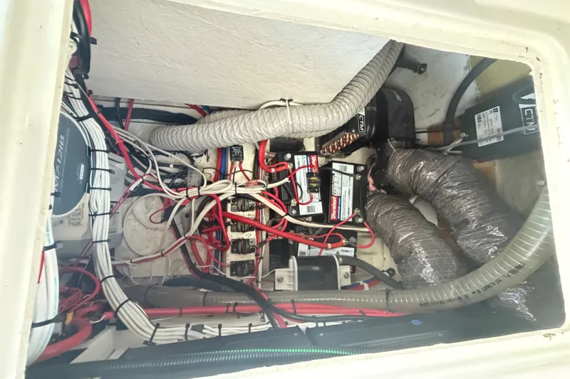 Slide: The Image of Electrical wiring and components inside a 2024 Sardine Marine 34 boat. - 18