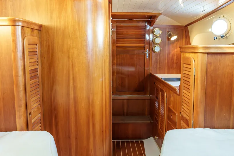 Slide: The Image of Interior of 2001 Hinckley Picnic Boat 36 EP with elegant wooden cabinetry and nautical decor. - 22