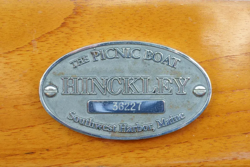 Slide: The Image of Hinckley Picnic Boat 36 EP 2001 nameplate, Southwest Harbor, Maine, on wooden surface. - 16