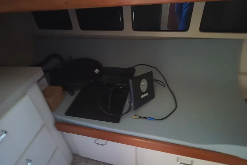Slide: The Image of Interior of 1994 Mainship 40 Sedan Bridge with electronic equipment on counter. - 30