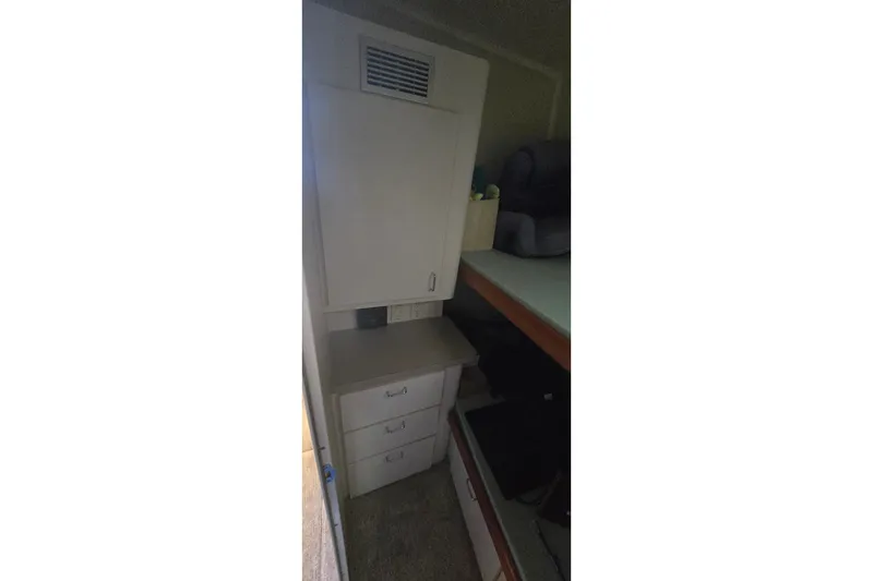 Slide: The Image of Interior of 1994 Mainship 40 Sedan Bridge with storage drawers and countertop. - 31
