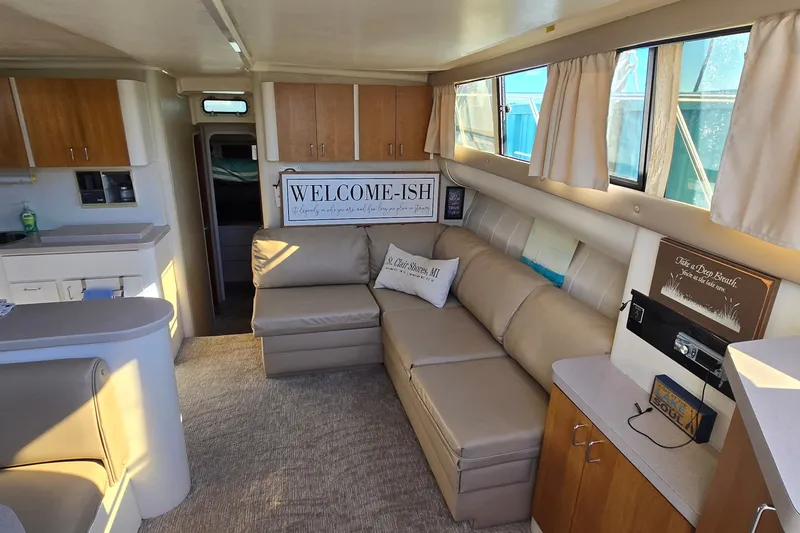 Slide: The Image of Interior of 1994 Mainship 40 Sedan Bridge with cozy seating and nautical decor. - 16
