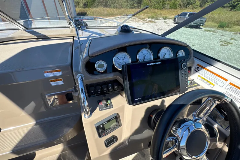 Slide: The Image of 2017 Regal 28 Express boat dashboard with gauges and navigation system. - 43