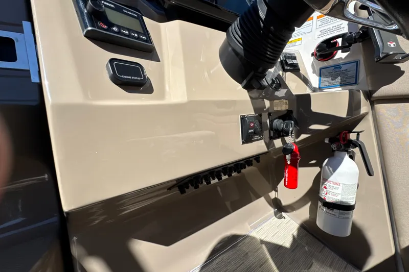 Slide: The Image of Close-up of the helm with instruments and a fire extinguisher. - 49