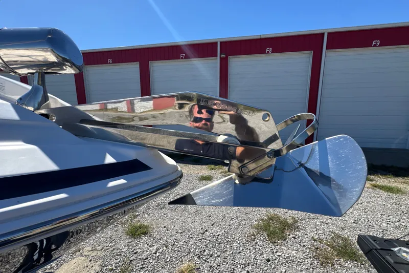 Slide: The Image of 2017 Regal 28 Express boat anchor detail with storage units in background. - 19
