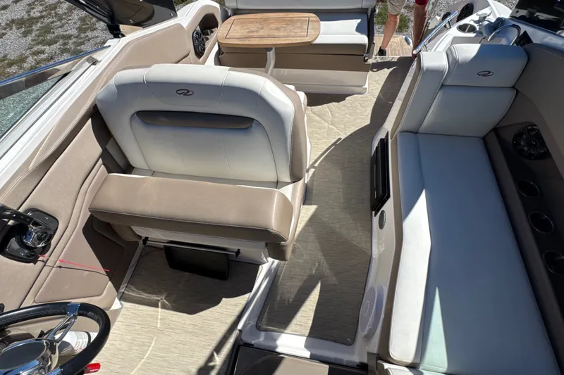 Slide: The Image of Interior of a 2017 Regal 28 Express boat with seating and table. - 61
