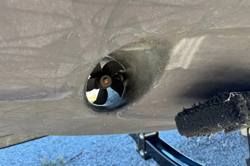 Slide: The Image of Close-up of a 2017 Regal 28 Express boat's bow thruster on a trailer. - 99