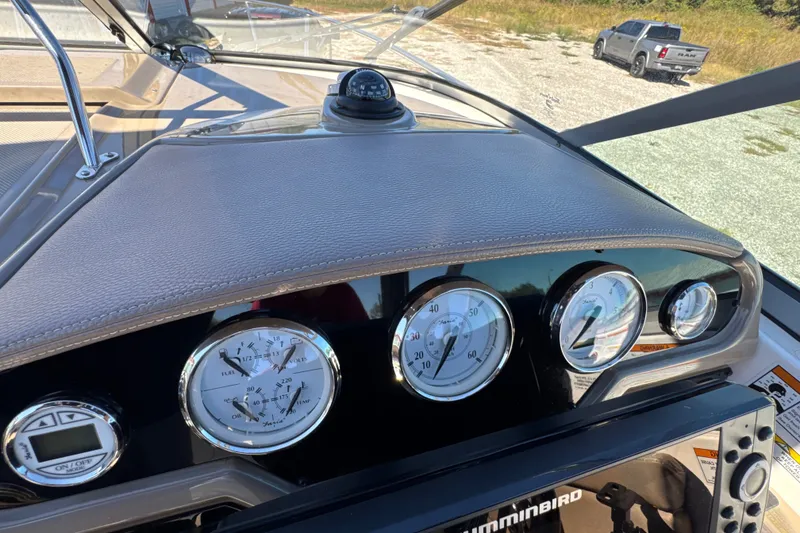 Slide: The Image of Dashboard of a 2017 Regal 28 Express boat with gauges and controls. - 45
