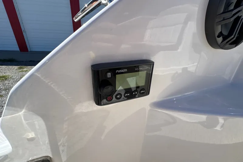 Slide: The Image of Fusion MS-NRX300 stereo control on 2017 Regal 28 Express boat dashboard. - 28