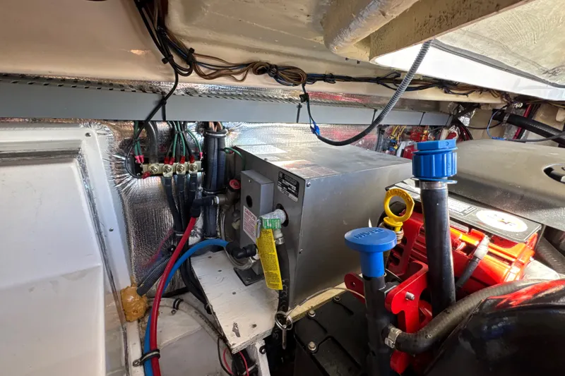 Slide: The Image of Engine compartment of a 2017 Regal 28 Express boat, showcasing wiring and components. - 67