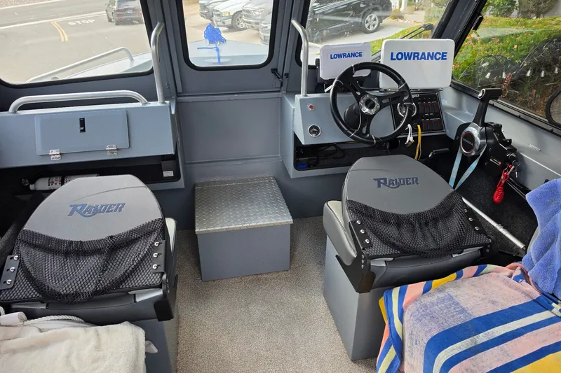 Slide: The Image of Interior of a 2019 Raider 190 Explorer boat with Lowrance navigation equipment. - 4