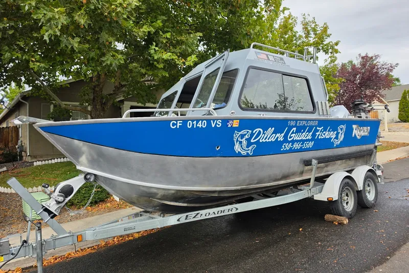 Slide: The Image of 2019 Raider 190 Explorer boat on trailer, featuring "Dillard Guided Fishing" branding. - 6