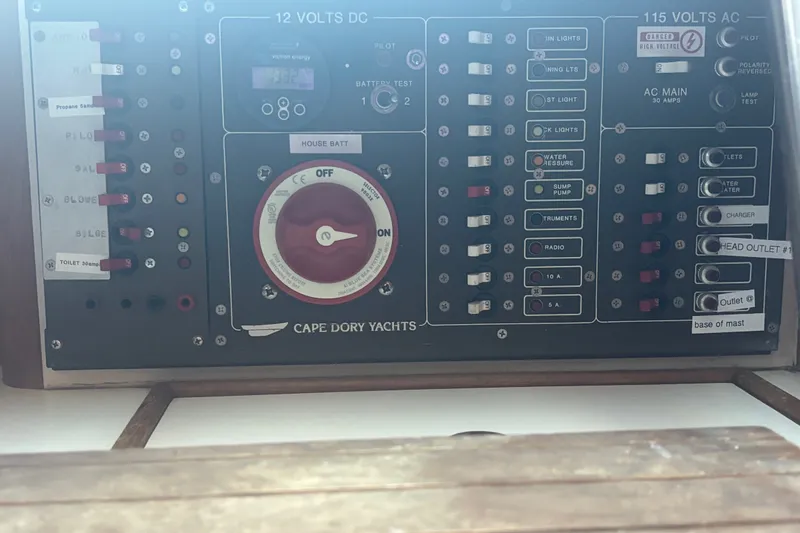 Slide: The Image of Electrical control panel on a 1985 Cape Dory 31 yacht, featuring switches and gauges. - 24