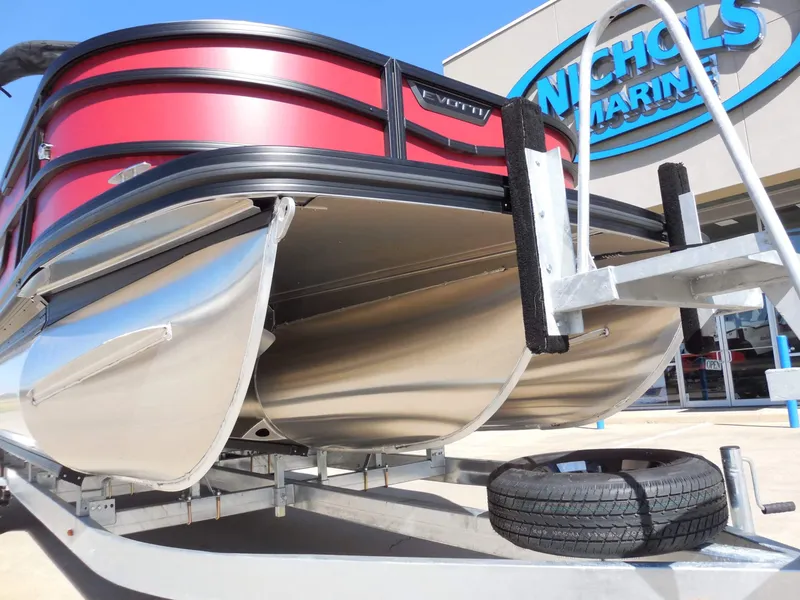 Slide: The Image of A 2027 Evotti 525CSA on a trailer in front of a building with a "Nichols Marine" sign. - 12