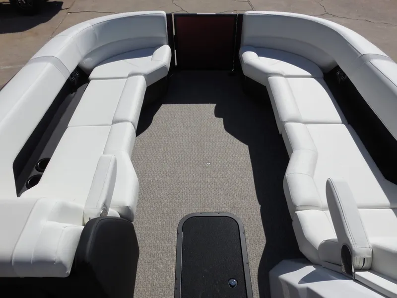 Slide: The Image of The image shows the spacious, cushioned interior of a 2027 Evotti 525CSA boat. - 28