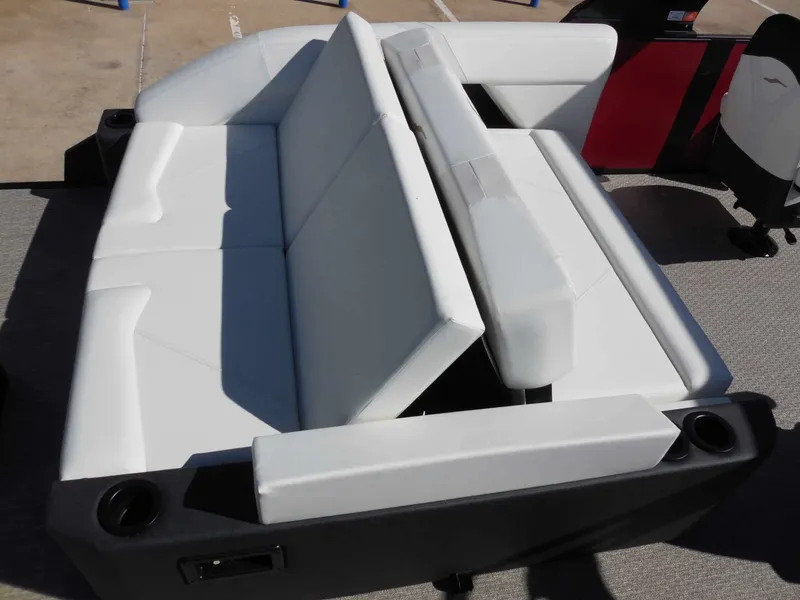 Slide: The Image of White cushioned boat seats with cup holders on an Evotti 525CSA from 2027. - 21