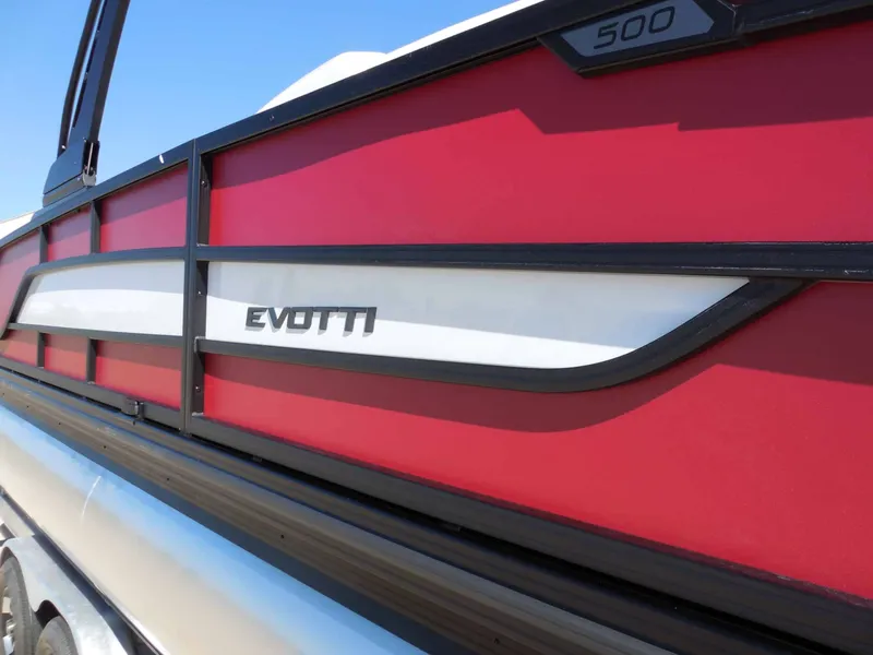 Slide: The Image of Side view of an Evotti 525CSA boat with red and white design. - 10