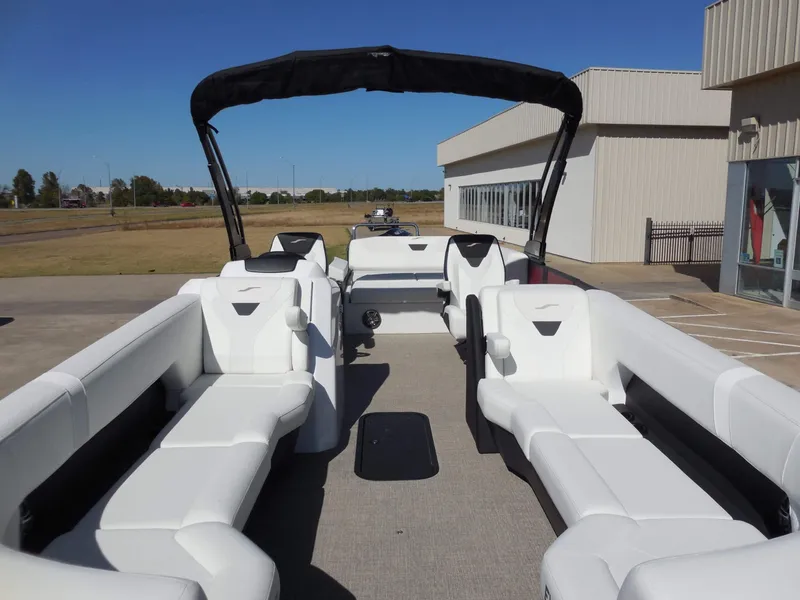 Slide: The Image of The image shows a modern boat with white upholstery and a black sunshade. - 13