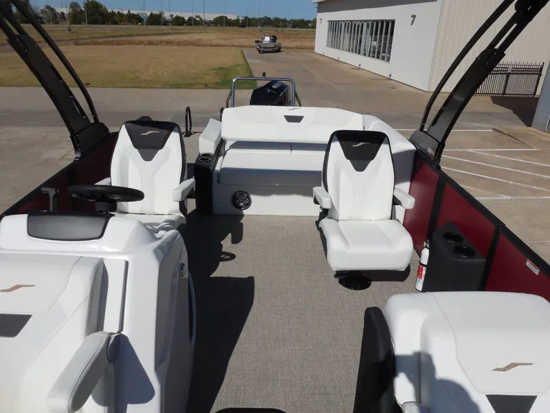 Slide: The Image of The image shows the interior of a 2027 Evotti 525CSA boat with white seats and gray flooring. - 16