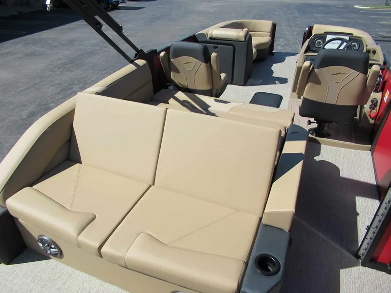 Slide: The Image of The image shows the interior of a 2027 Evotti 521CS boat with beige seating. - 12