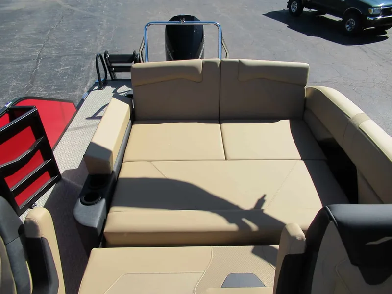 Slide: The Image of The image shows the beige upholstery of a 2027 Evotti 521CS with cup holders. - 11