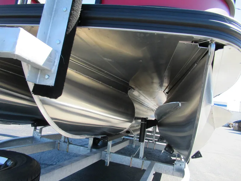 Slide: The Image of Underside of an Evotti 521CS pontoon boat on a trailer, featuring aluminum hulls. - 13