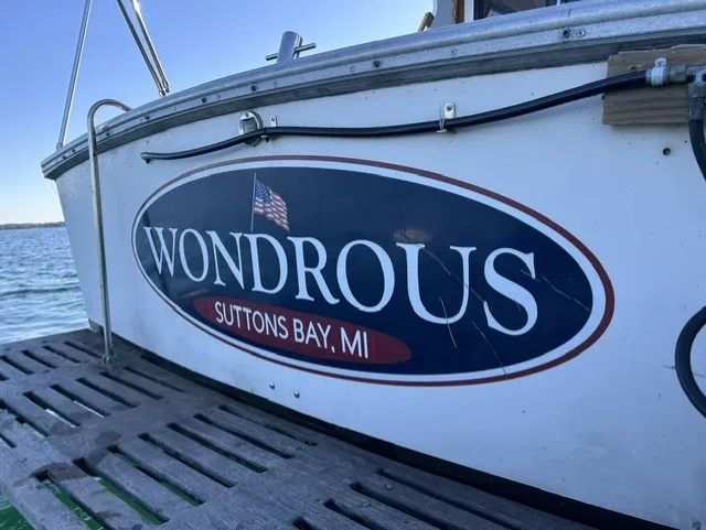 Slide: The Image of The stern of a 1979 Mainship 34 Trawler named "Wondrous" from Suttons Bay, MI. - 3