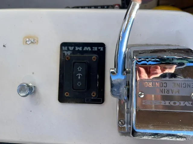 Slide: The Image of Close-up of a throttle lever and switch on a boat. - 28