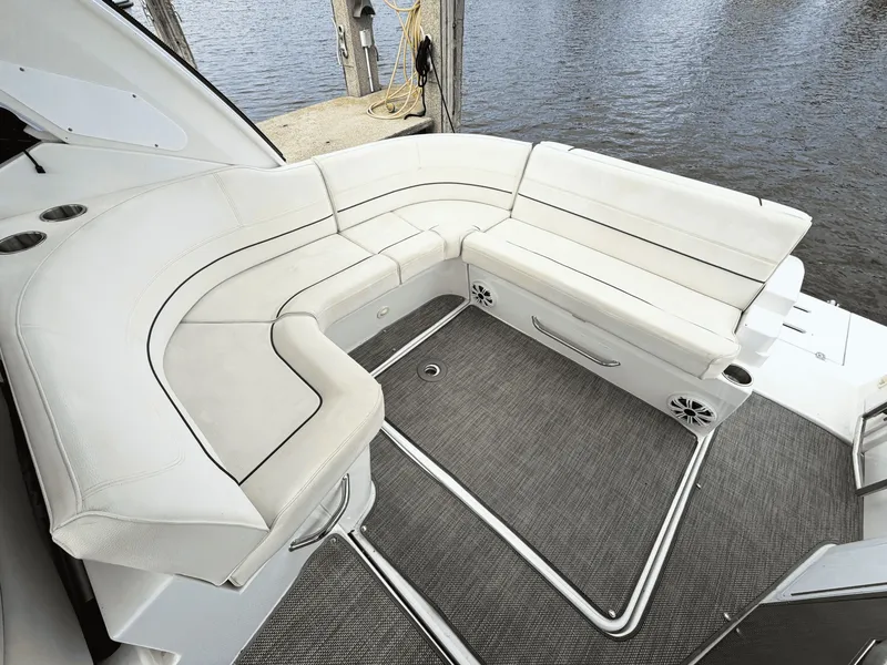 Slide: The Image of The image shows a luxurious white seating area on a boat, overlooking the water. - 8