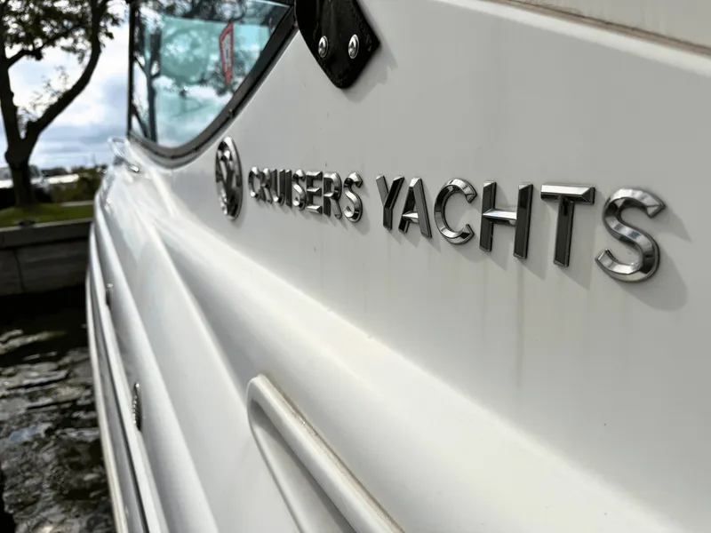 Slide: The Image of Close-up of the "Cruisers Yachts" lettering on a white boat. - 23
