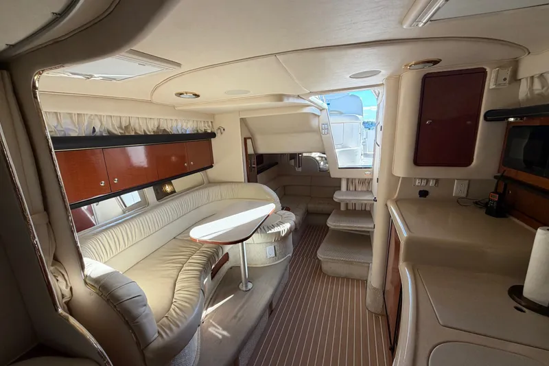 Slide: The Image of Luxurious interior of a 2002 Sea Ray 340 Sundancer yacht with elegant seating and cabinetry. - 28