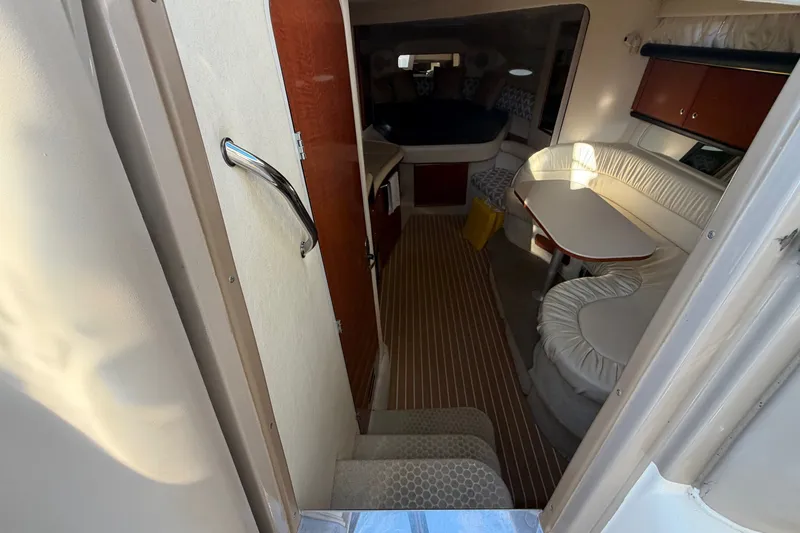 Slide: The Image of Interior view of 2002 Sea Ray 340 Sundancer cabin with seating and table. - 26