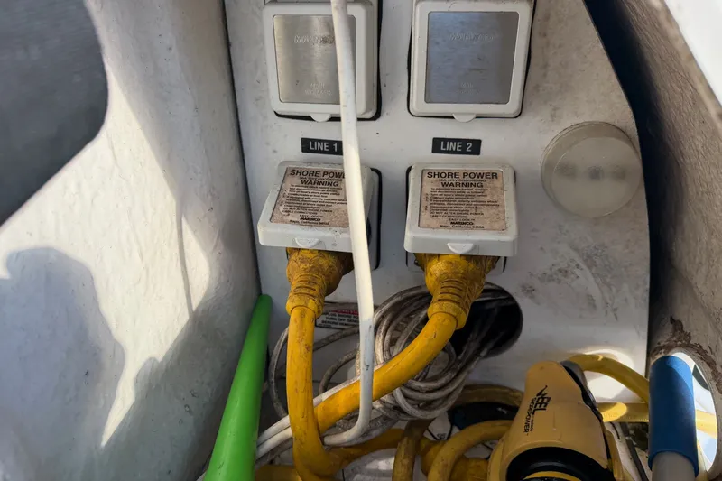 Slide: The Image of Shore power connections on a 2002 Sea Ray 340 Sundancer boat. - 12