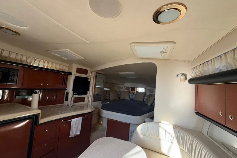 Slide: The Image of Luxurious interior of a 2002 Sea Ray 340 Sundancer yacht with cozy seating and modern amenities. - 39